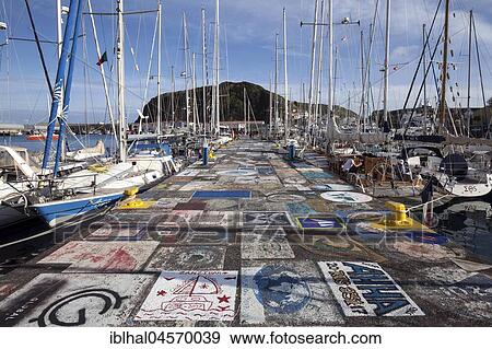 Stock Photo - Sailor painted quay wall, harbour, marina, Horta, island of Faial, Azores, Portugal, Europe. Fotosearch