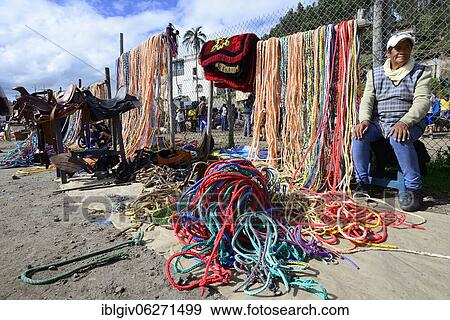 Stock Photo - Sale of ropes and saddles at the weekly cattle market, Otavalo, Imbabura province, Ecuador, South America. Fotosearch