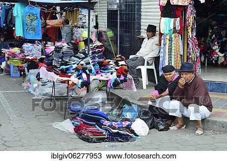 Stock Image - Sale of textiles at the market, Otavalo, Imbabura province, Ecuador, South America. Fotosearch