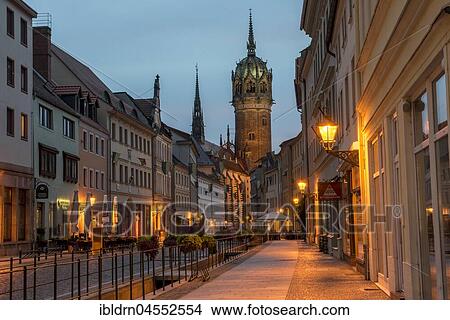 Schlossstraße with tower of the castle church, evening atmosphere, Luther city Wittenberg, Saxony-Anhalt, Germany, Europe View Large Photo Image Picture - Schlossstraße with tower of the castle church, evening atmosphere, Luther city Wittenberg, Saxony-Anhalt, Germany, Europe. Fotosearch