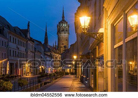 Schlossstraße with tower of the castle church, evening atmosphere, Luther city Wittenberg, Saxony-Anhalt, Germany, Europe View Large Photo Image Stock Photograph - Schlossstraße with tower of the castle church, evening atmosphere, Luther city Wittenberg, Saxony-Anhalt, Germany, Europe. Fotosearch