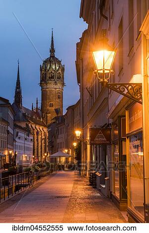 Stock Photography - Schlossstraße with tower of the castle church, evening atmosphere, Luther city Wittenberg, Saxony-Anhalt, Germany, Europe. Fotosearch