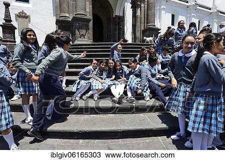 Stock Image - School class in school uniform on the steps of the cathedral, Catedral Metropolitana, Quito, Pichincha Province, Ecuador, South America. Fotosearch
