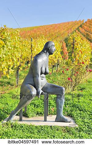 Seated bronze sculpture by Karl Ulrich Nuss in front of vineyards in autumn, sculpture path Strümpfelbach, Remstal, Baden-Württemberg, Germany, Europe View Large Photo Image Stock Image - Seated bronze sculpture by Karl Ulrich Nuss in front of vineyards in autumn, sculpture path Strümpfelbach, Remstal, Baden-Württemberg, Germany, Europe. Fotosearch