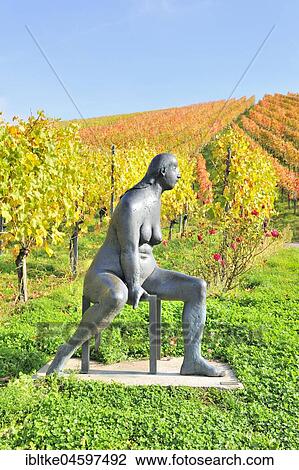 Seated bronze sculpture by Karl Ulrich Nuss in front of vineyards in autumn, sculpture path Strümpfelbach, Remstal, Baden-Württemberg, Germany, Europe View Large Photo Image Stock Image - Seated bronze sculpture by Karl Ulrich Nuss in front of vineyards in autumn, sculpture path Strümpfelbach, Remstal, Baden-Württemberg, Germany, Europe. Fotosearch