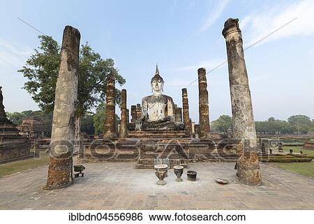 Stock Photograph - Seated Buddha statue at Wat Mahathat, Sukhothai historical park, Sukhothai, Thailand, Asia. Fotosearch