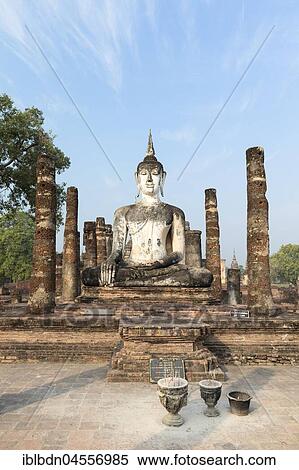 Seated Buddha statue at Wat Mahathat, Sukhothai historical park, Sukhothai, Thailand, Asia View Large Photo Image Stock Photography - Seated Buddha statue at Wat Mahathat, Sukhothai historical park, Sukhothai, Thailand, Asia. Fotosearch