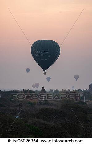 Picture - Several balloons over a temple, Bagan, Myanmar, Asia. Fotosearch