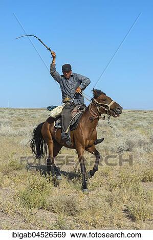 Stock Photo - Sheep Herder with horsewhip, Tien Shan Mountains, Kazakhstan, Asia. Fotosearch