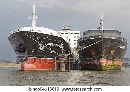 Ships riding at anchor in the harbor in the Norderelbe, Hamburg, Germany, Europe View Large Photo Image Stock Image - Ships riding at anchor in the harbor in the Norderelbe, Hamburg, Germany, Europe. Fotosearch