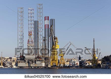 Shipyard with cranes, docks at Grand Harbor, Valletta, Malta, Europe View Large Photo Image Stock Image - Shipyard with cranes, docks at Grand Harbor, Valletta, Malta, Europe. Fotosearch