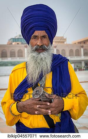 Stock Image - Sikh guard with saber, portrait, Golden Temple, Amritsar, Punjab, North India, India, Asia. Fotosearch