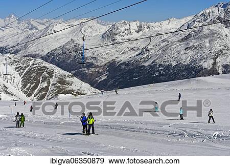 Skiers on the ski slope on the Fee glacier, Saas-Fee, Valais, Switzerland, Europe View Large Photo Image Stock Photo - Skiers on the ski slope on the Fee glacier, Saas-Fee, Valais, Switzerland, Europe. Fotosearch