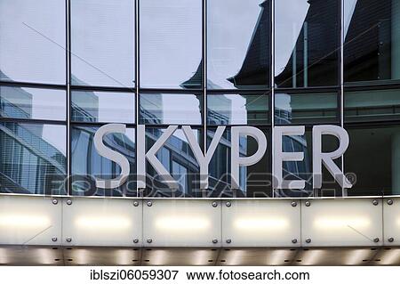 Skyper lettering in front of glass facade, ensemble of buildings in the area around the train station, Frankfurt am Main, Hesse, Germany, Europe View Large Photo Image Stock Photo - Skyper lettering in front of glass facade, ensemble of buildings in the area around the train station, Frankfurt am Main, Hesse, Germany, Europe. Fotosearch