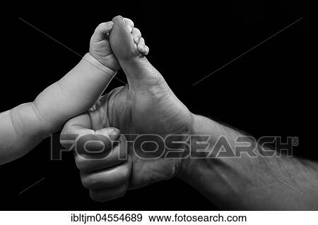 Small and big hand, baby holds father's thumb View Large Photo Image Stock Photo - Small and big hand, baby holds father's thumb. Fotosearch