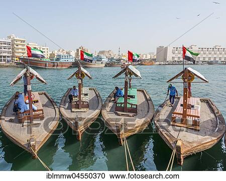 Stock Image - Small traditional ships on the Creek, Old Dubai, United Arab Emirates, Asia. Fotosearch