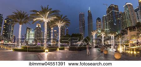 Stock Image - Square with illuminated palm trees, Night Scene, Dubai Marina, Dubai, United Arab Emirates, Asia. Fotosearch