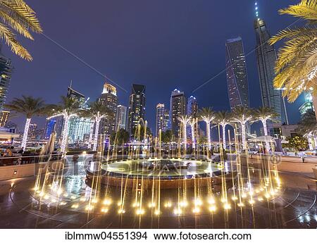 Square with illuminated well, night photo, Dubai Marina, Dubai, Dubai, United Arab Emirates, Asia View Large Photo Image Picture - Square with illuminated well, night photo, Dubai Marina, Dubai, Dubai, United Arab Emirates, Asia. Fotosearch