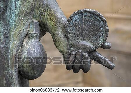 St. James pilgrim statue, detail of a scallop shell and drinking bottle, in front of the Lutheran town church St. Marien in Gunzenhausen, Bavaria, Germany, Europe View Large Photo Image Stock Image - St. James pilgrim statue, detail of a scallop shell and drinking bottle, in front of the Lutheran town church St. Marien in Gunzenhausen, Bavaria, Germany, Europe. Fotosearch