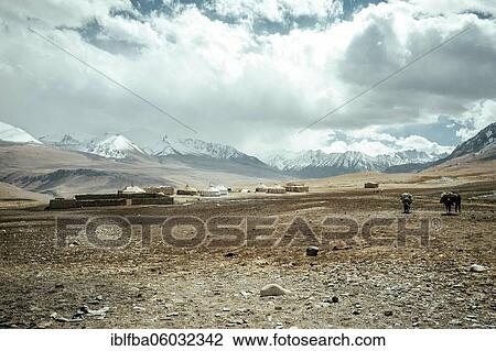 Stables made of stone and yurts of a Kyrgyz nomad camp, two men ride towards it, behind them the snow-covered peaks of the Hindu Kush, Khadz Goz, Wakhan Corridor, Badakhshan, Afghanistan, Asia View Large Photo Image Stock Image - Stables made of stone and yurts of a Kyrgyz nomad camp, two men ride towards it, behind them the snow-covered peaks of the Hindu Kush, Khadz Goz, Wakhan Corridor, Badakhshan, Afghanistan, Asia. Fotosearch