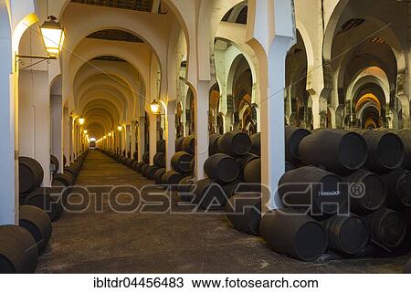 Stacked oak barrels in the wine cellar La Mezquita, winery Bodega Fundador Pedro Domecq, Jerez de la Frontera, Cadiz province, Andalusia, Spain, Europe View Large Photo Image Stock Image - Stacked oak barrels in the wine cellar La Mezquita, winery Bodega Fundador Pedro Domecq, Jerez de la Frontera, Cadiz province, Andalusia, Spain, Europe. Fotosearch