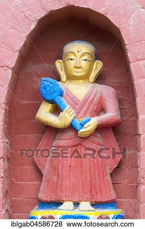 Stock Photo - Statue decorating the base of the Bumisparsha mudra Buddha Statue, Swayambunath or Monkey Temple, Kathmandu, Nepal, Asia. Fotosearch