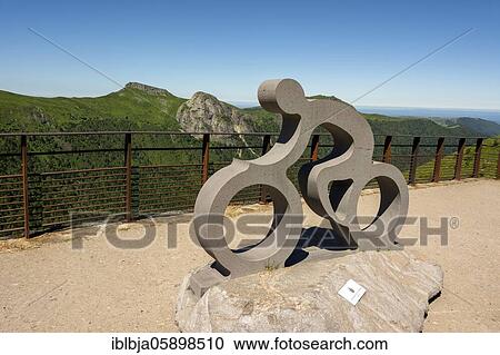 Statue le Velo of Emmanuel Hebrard at the top of Pas de Peyrol in the Auvergne volcanoes regional natural park, Cantal Auvergne Rhone Alpes, France, Europe View Large Photo Image Stock Image - Statue le Velo of Emmanuel Hebrard at the top of Pas de Peyrol in the Auvergne volcanoes regional natural park, Cantal Auvergne Rhone Alpes, France, Europe. Fotosearch
