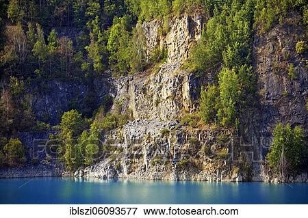 Steep face at the Prangenhaus limestone quarry with lake, Wülfrath, Bergisches Land, North Rhine-Westphalia, Germany, Europe View Large Photo Image Stock Photo - Steep face at the Prangenhaus limestone quarry with lake, Wülfrath, Bergisches Land, North Rhine-Westphalia, Germany, Europe. Fotosearch