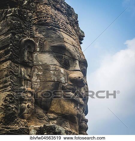 Stock Photo - Stone face, Bodhisattva Lokeshvara, Avalokiteshvara, Temple ruin, Bayon Temple, Angkor Thom Complex, Angkor Archaeological Park, Province of Siem Reap, Cambodia, Asia. Fotosearch