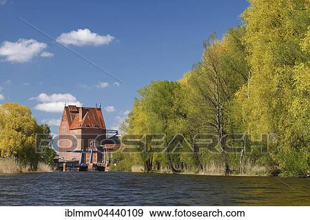 Storage building at harbour, River Peene, Hanseatic city of Demmin, Peenetal Nature Park, Mecklenburg-Western Pomerania, Germany, Europe View Large Photo Image Stock Photo - Storage building at harbour, River Peene, Hanseatic city of Demmin, Peenetal Nature Park, Mecklenburg-Western Pomerania, Germany, Europe. Fotosearch