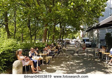 Street café at Münchner Freiheit, Schwabing, Munich, Upper Bavaria, Bavaria, Germany, Europe View Large Photo Image Stock Photo - Street café at Münchner Freiheit, Schwabing, Munich, Upper Bavaria, Bavaria, Germany, Europe. Fotosearch