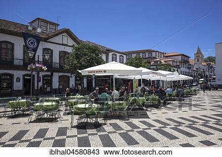 Stock Image - Street café on the Praca Velha, Angra do Heroismo, UNESCO World Heritage Site, Terceira Island, Azores, Portugal, Europe. Fotosearch