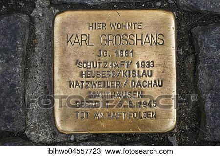 Stock Image - Stumbling block, brass plaque in pavement, in remembrance of victims of the Nazi era, art project by Gunter Demmig, Constance, Baden-Württemberg, Germany, Europe. Fotosearch