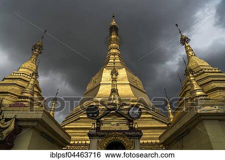 Stock Photograph - Sule Pagoda in Yangon, dark clouds, Myanmar, Asia. Fotosearch