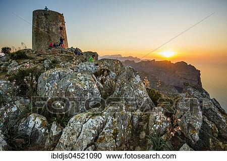 Stock Image - Sunset, Watchtower Talaia d'Albercutx, Cap Formentor, Port de Pollença, Serra de Tramuntana, Majorca, Balearics, Spain, Europe. Fotosearch
