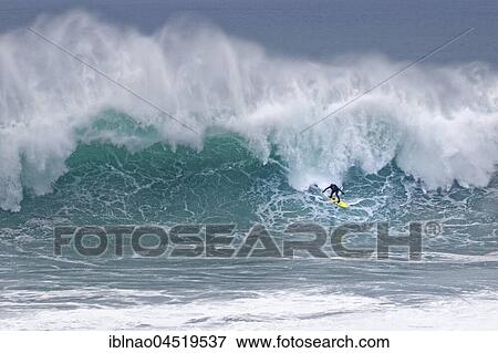 Surfers in a wave, Nazare, Portugal, Europe View Large Photo Image Stock Photo - Surfers in a wave, Nazare, Portugal, Europe. Fotosearch