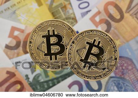 Symbol image cryptocurrency, digital currency, golden physical coin Bitcoin on EURO banknotes View Large Photo Image Stock Image - Symbol image cryptocurrency, digital currency, golden physical coin Bitcoin on EURO banknotes. Fotosearch