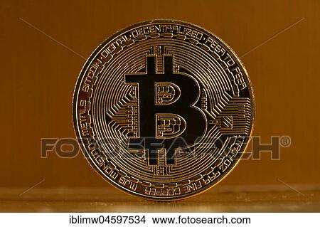 Symbol image digital currency, gold physical coin Bitcoin front side View Large Photo Image Picture - Symbol image digital currency, gold physical coin Bitcoin front side. Fotosearch