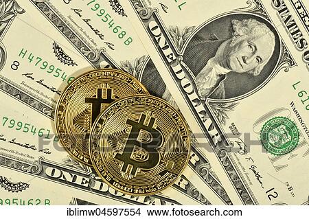 Symbol image digital currency, gold physical coin Bitcoin on banknote US dollar View Large Photo Image Picture - Symbol image digital currency, gold physical coin Bitcoin on banknote US dollar. Fotosearch