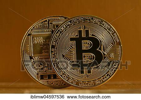 Stock Photograph - Symbol image digital currency, gold physical coin bitcoin front side back side. Fotosearch