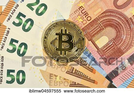 Stock Photography - Symbol image digital currency, gold physical coin Bitcoin. Fotosearch
