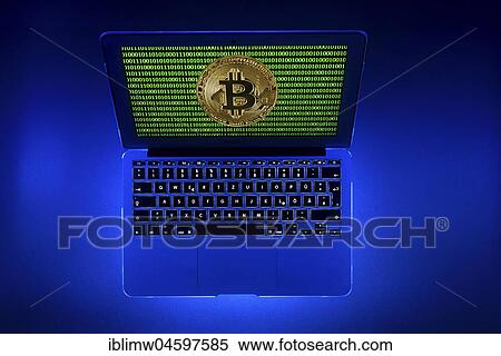Stock Photography - Symbol image digital currency, gold physical coin bitcoin laptop with digital binary code. Fotosearch