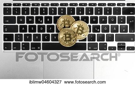 Symbol image digital currency, golden physical coin bitcoin keyboard laptop keyboard View Large Photo Image Stock Photo - Symbol image digital currency, golden physical coin bitcoin keyboard laptop keyboard. Fotosearch