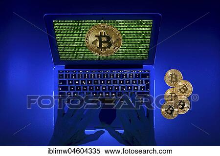 Symbol image digital currency, golden physical coin bitcoin laptop with digital binary hands View Large Photo Image Stock Photography - Symbol image digital currency, golden physical coin bitcoin laptop with digital binary hands. Fotosearch