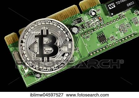 Symbol image digital currency, silver physical coin Bitcoin on printed circuit board View Large Photo Image Stock Photo - Symbol image digital currency, silver physical coin Bitcoin on printed circuit board. Fotosearch
