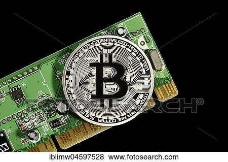 Symbol image digital currency, silver physical coin Bitcoin on printed circuit board View Large Photo Image Stock Photo - Symbol image digital currency, silver physical coin Bitcoin on printed circuit board. Fotosearch