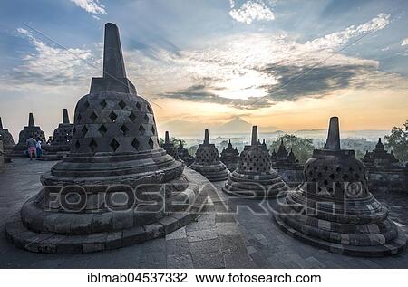 Temple complex Borobudur at sunrise, Stupas, cloudy sky, Borobudur, Yogyakarta, Java, Indonesia, Asia View Large Photo Image Stock Image - Temple complex Borobudur at sunrise, Stupas, cloudy sky, Borobudur, Yogyakarta, Java, Indonesia, Asia. Fotosearch