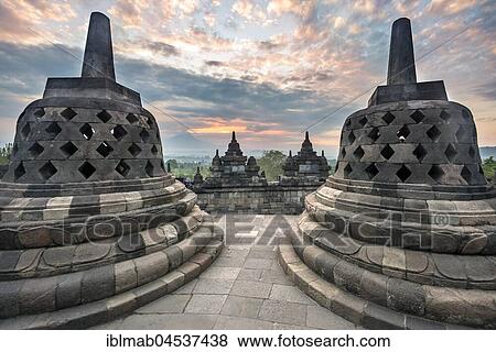 Temple complex Borobudur at sunrise, Stupas, cloudy sky, Borobudur, Yogyakarta, Java, Indonesia, Asia View Large Photo Image Stock Photo - Temple complex Borobudur at sunrise, Stupas, cloudy sky, Borobudur, Yogyakarta, Java, Indonesia, Asia. Fotosearch