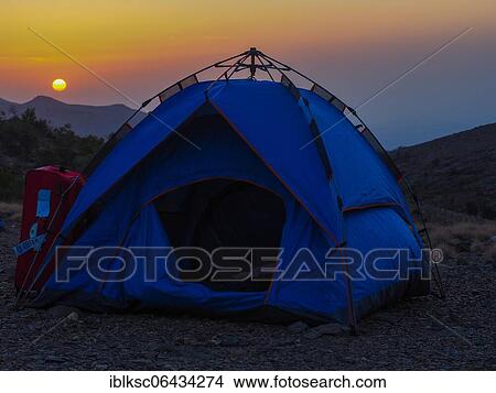Picture - Tent at sunset, rock scenery of the Djabal Mischt, Hadjar Mountains, Oman, Asia. Fotosearch