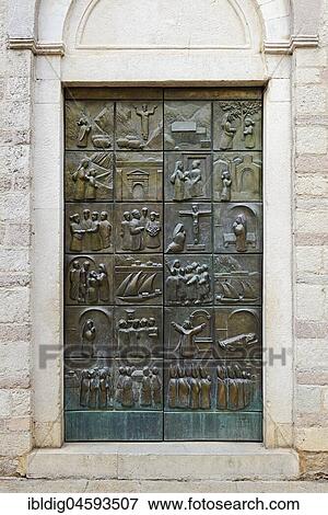 Stock Photo - The door of Saint Mary's church depicting the life of Blessed Osanna of Cattaro, Kotor, Monte, Europe. Fotosearch